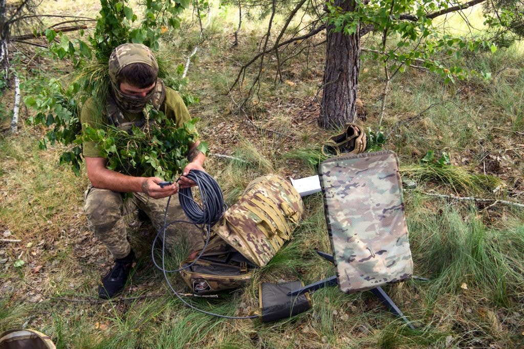 A Ukrainian soldier uses a Starlink terminal during military exercises in Chernihiv Oblast, Ukraine, in June 2023. Photo for illustrative purposes. (Maxym Marusenko/NurPhoto/Getty Images)