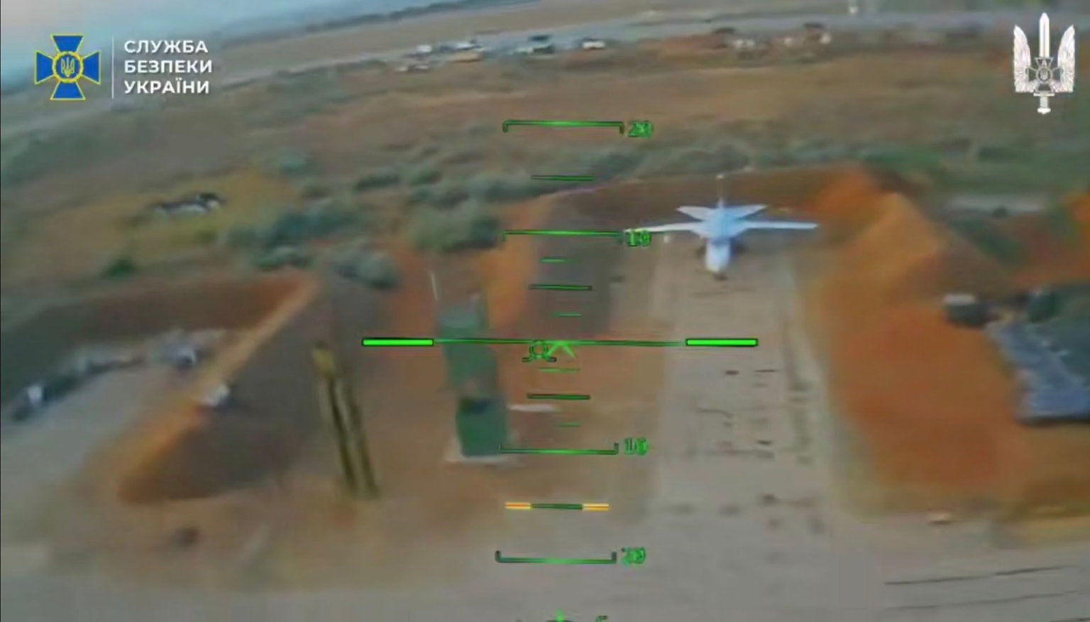 A screenshot from a video released by Ukraine's Security Service (SBU) on Jan. 28, 2026, showing drone strikes against Russian military aircraft (SBU/Telegram)
