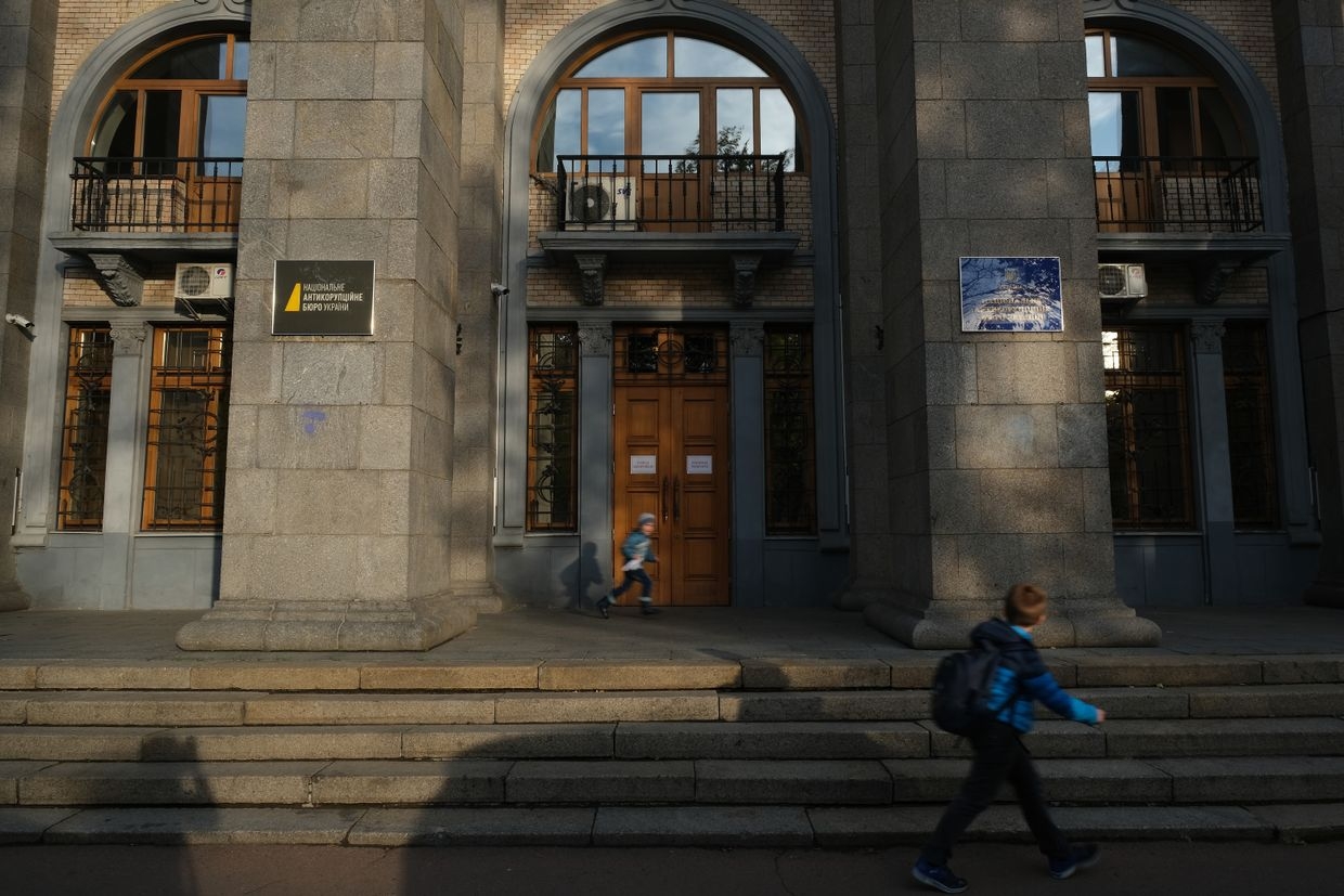 Children walk past the offices of the National Anti-Corruption Bureau of Ukraine (NABU) in Kyiv, Ukraine, on Oct. 1, 2019.
