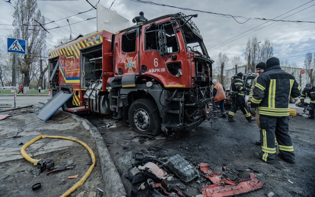 Firefighters inspect a damaged fire truck after a Russian double-tap drone attack in Kharkiv, Ukraine on April 4, 2024. 