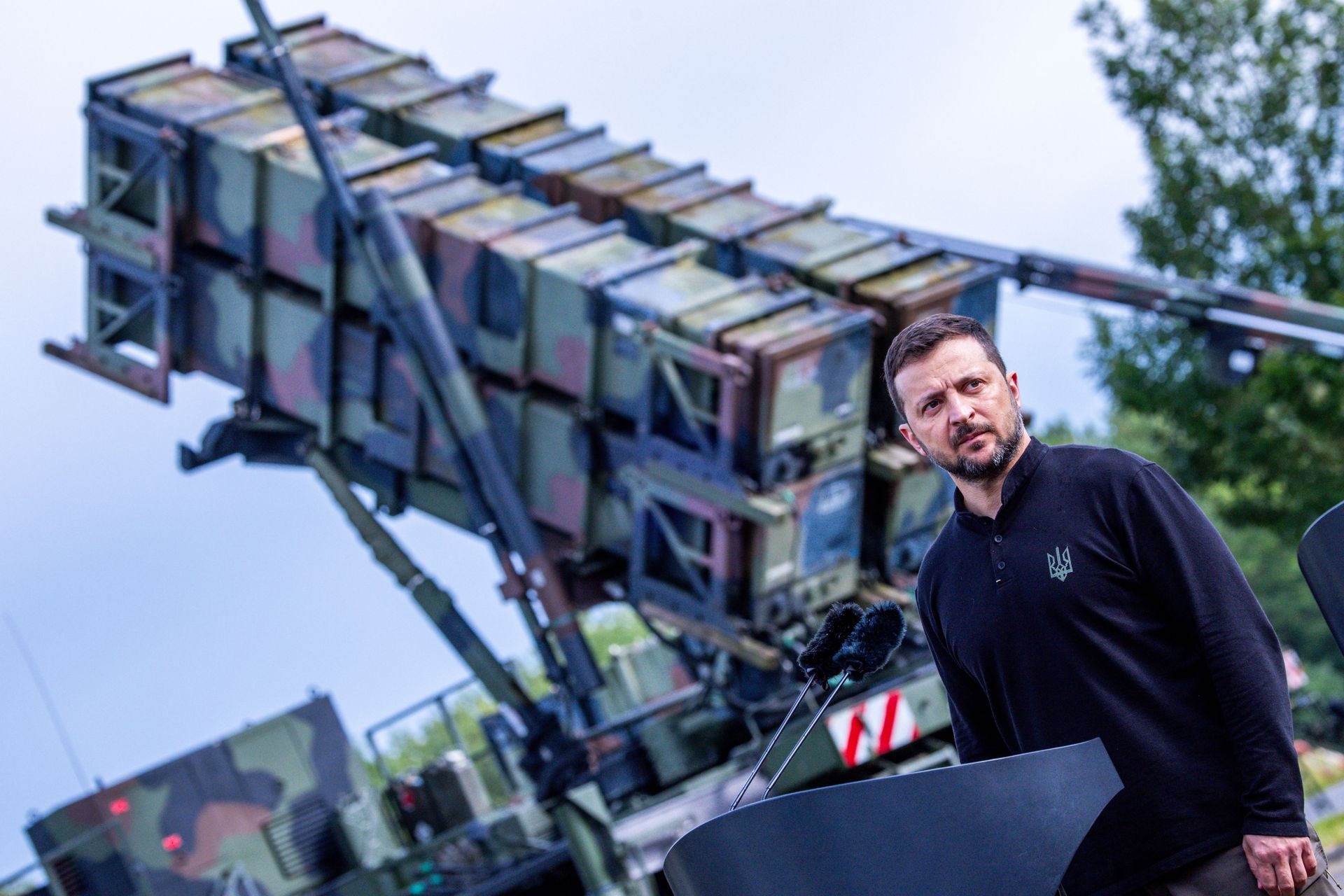 President Volodymyr Zelensky stands in front of a Patriot air defense missile system at a military training area in Mecklenburg-Western Pomerania, Germany, on June 11, 2024. 