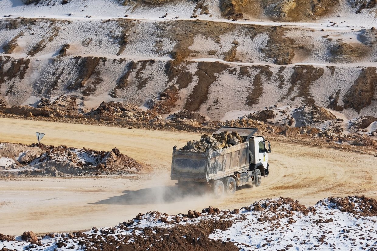 Earth and minerals are loaded onto trucks at an open-pit mine near the frontline in Donetsk Oblast, Ukraine, on Feb. 26, 2025