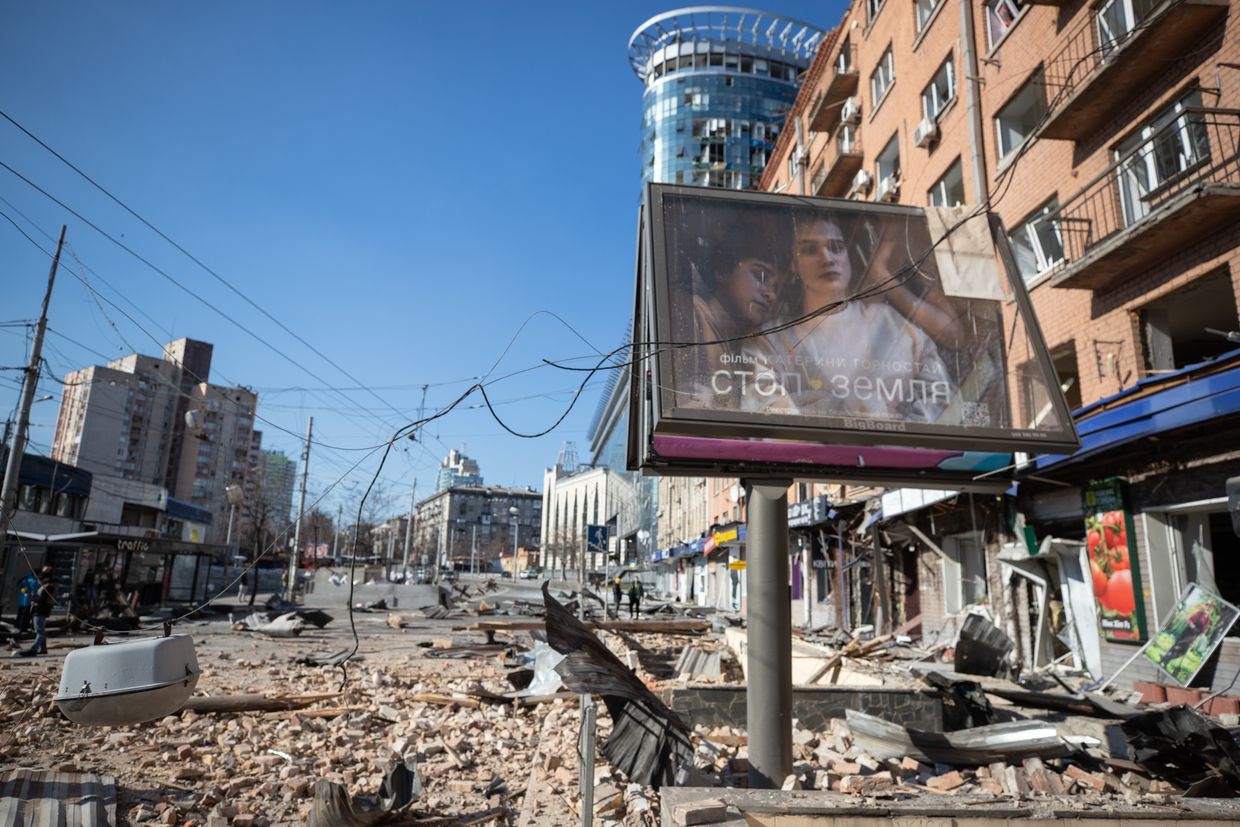 Debris from damaged buildings lies in a street after shelling near Lukianivska metro station in Kyiv, Ukraine, on March 14, 2022. 