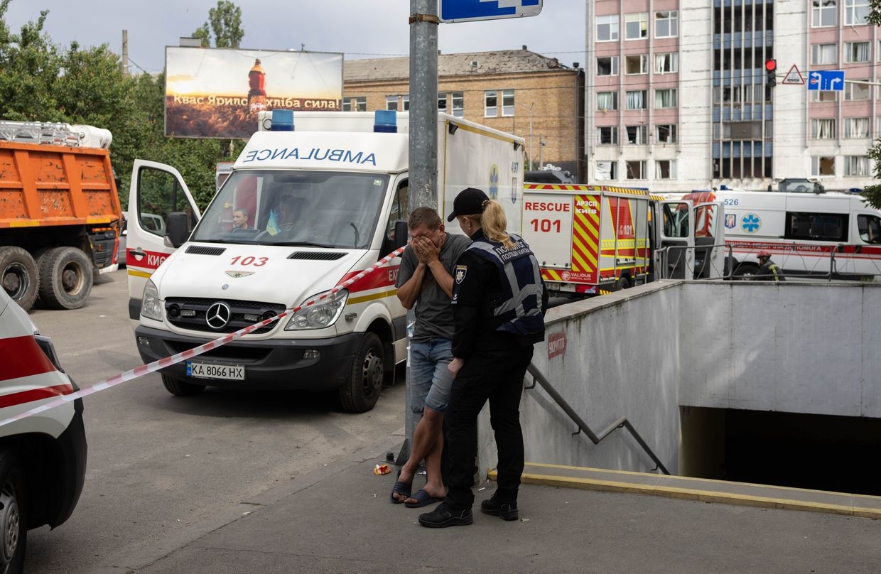 A man cries near the house that was struck by a Russian missile in Kyiv, Ukraine, on June 17, 2025. 