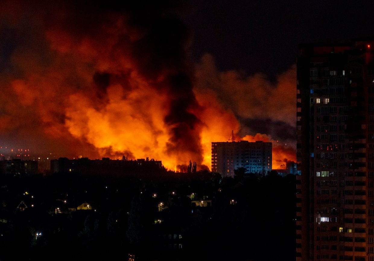 Flames and smoke billow from buildings during mass Russian drone and missile strikes on Kyiv, Ukraine on July 4, 2025. 