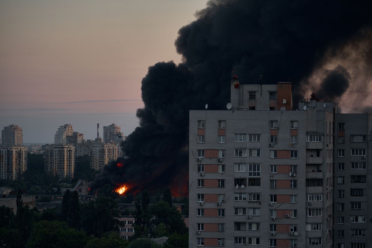 A large plume of smoke rises from a fire after a mass drone and missile attack by the Russian Federation on the capital on July 4, 2025, in Kyiv, Ukraine. 