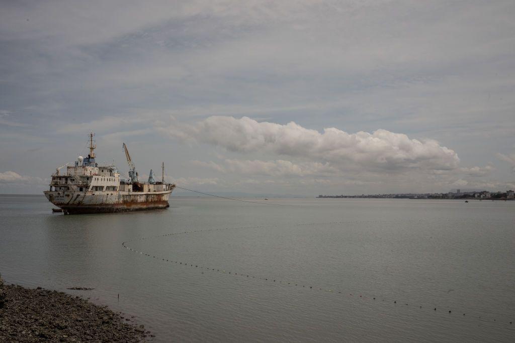 A ship leaves the harbor in Conakry, Guinea on Sept. 28, 2023
