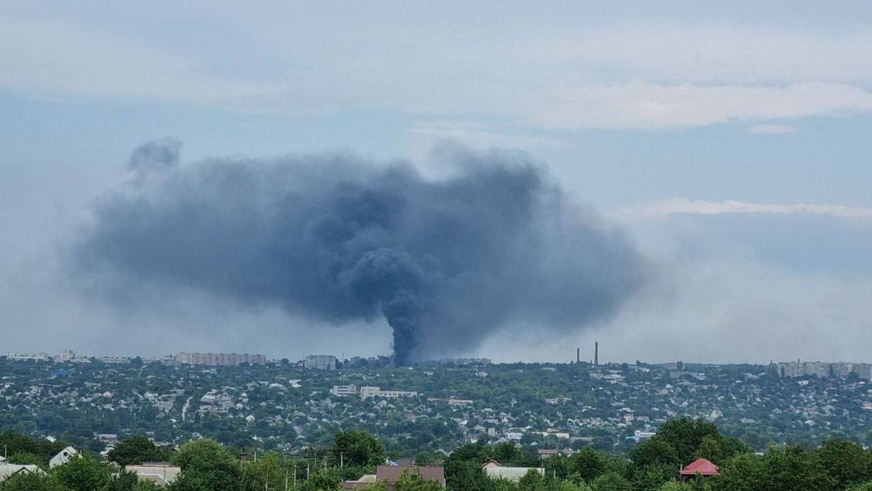 A smoke rising over the Factory 100 machine repair plant in Luhansk.