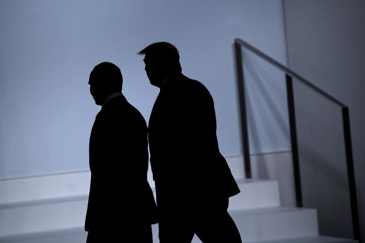 Putin (L) and Trump (R) arrive for a group photo at the G20 Summit in Osaka, Japan on June 28, 2019.