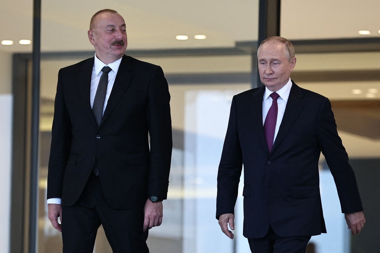 Russia's President Vladimir Putin (R) and Azerbaijan's President Ilham Aliyev (L) in Baku, Azerbaijan, on Aug. 19, 2024.