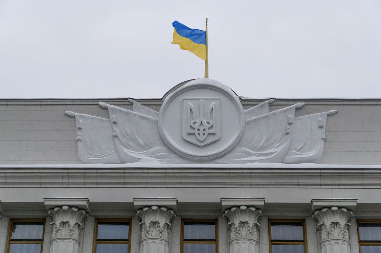 A Ukrainian flag flies above the headquarters of the Ukrainian Finance Ministry in Kyiv, Ukraine, on Feb. 8, 2017.