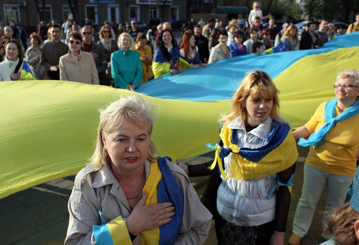Mariupol locals sing the national anthem during a rally in Mariupol, Ukraine, on April 23, 2014.