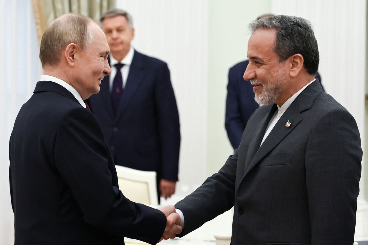 Illustrative photo: Russian President Vladimir Putin and Iranian Foreign Minister Abbas Araghchi shake hands during a meeting at the Kremlin in Moscow on June 23, 2025 (Alexander Kazakov/Pool/AFP via Getty Images)