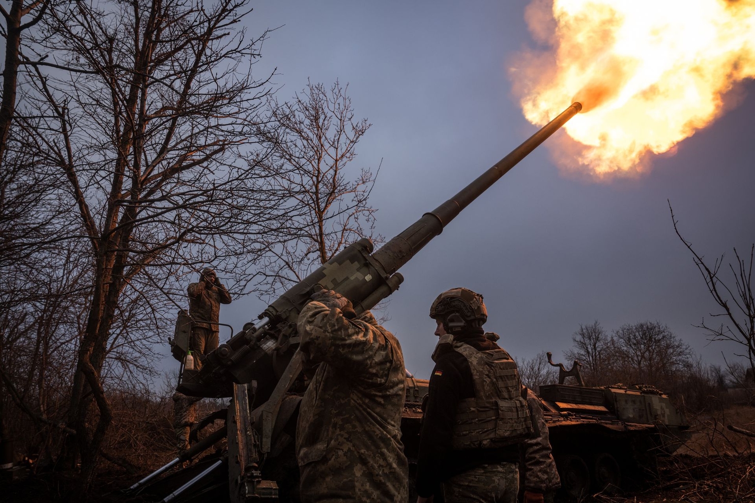 Ukrainian soldiers of the 43rd Brigade work on a Soviet-era Pion self-propelled howitzer in the direction of Chasiv Yar, Ukraine, on Jan. 27, 2025.