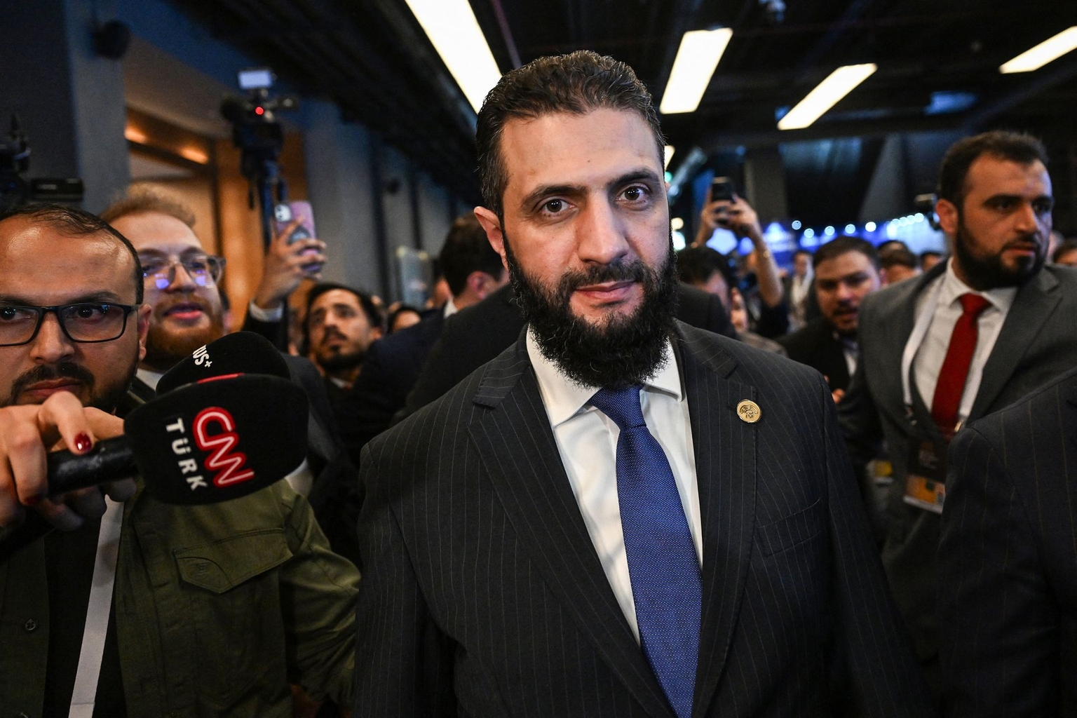 Syria’s then-interim President Ahmed al-Sharaa (C) in Antalya, Turkey, on April 11, 2025.