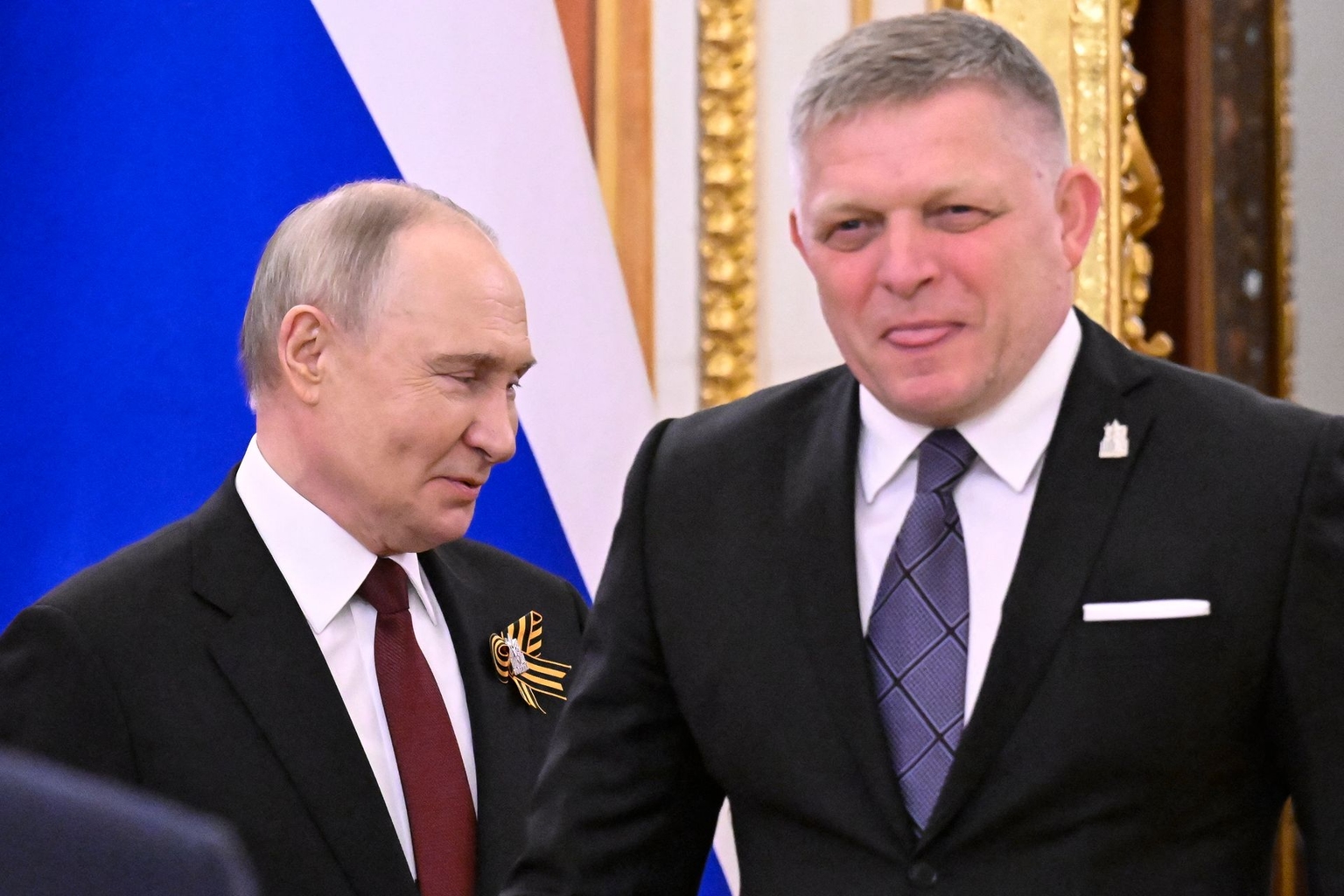 Russian President Vladimir Putin (L) meets with Slovak Prime Minister Robert Fico (R) at the Kremlin in Moscow, Russia, on May 9, 2025.