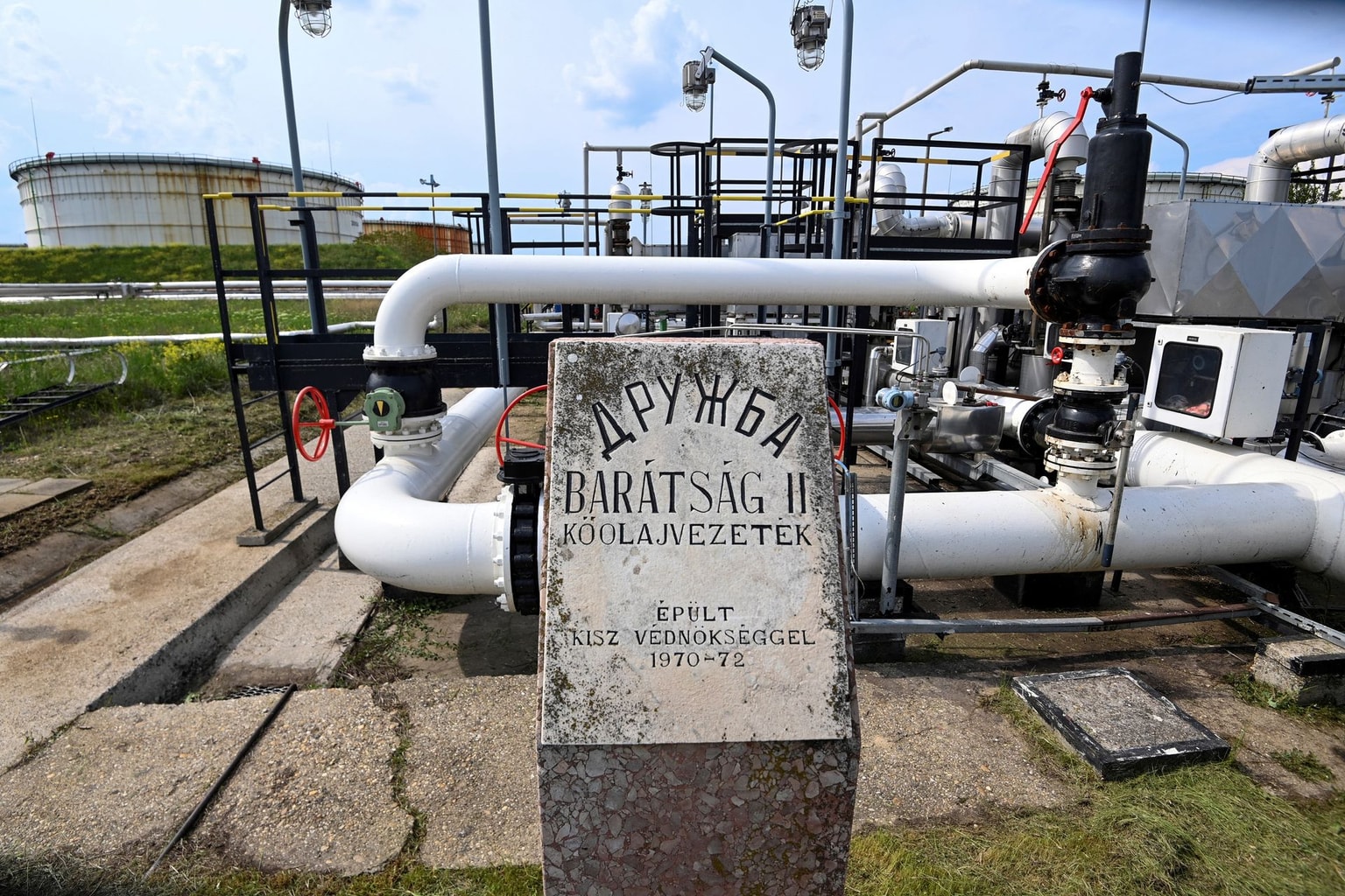 The Druzhba petroleum pipeline between Hungary and Russia, featuring a memorial plaque commemorating its construction at the Danube Refinery of the Hungarian MOL Company on May 5, 2022 (Attila Kisbenedek/AFP via Getty Images)