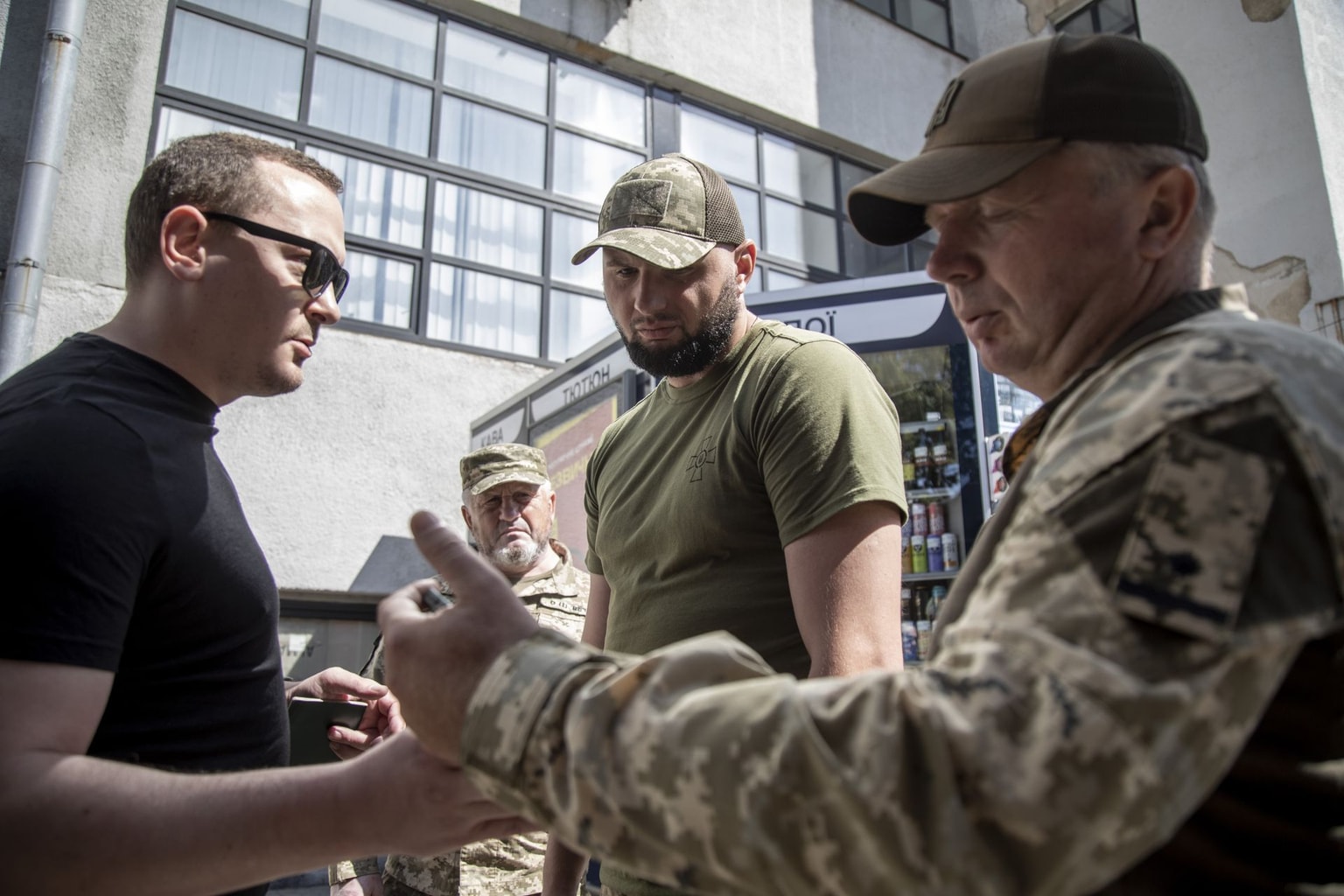 Members of the Kharkiv Regional Recruitment Office check a civilian's documentation in Kharkiv, Ukraine, on Aug. 8, 2024.