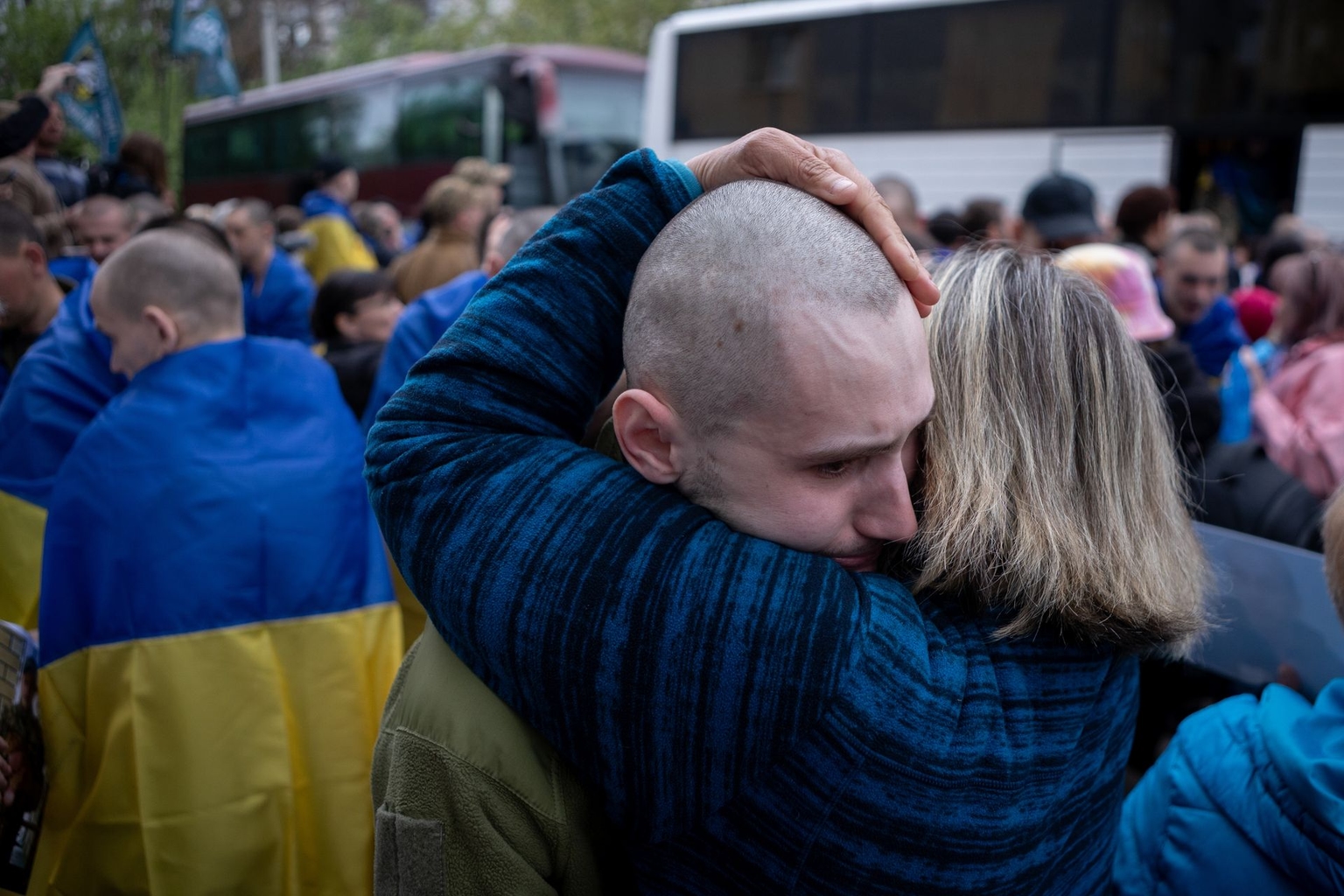 Relatives embrace a Ukrainian soldier released from Russian captivity during a prisoner exchange between Ukraine and Russia in May 2025