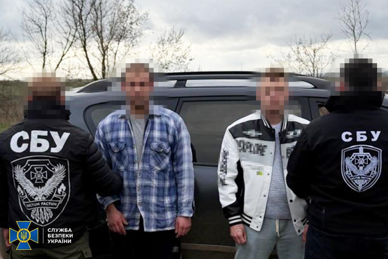 Ukraine's State Security Service on Dec 23, 2025, released this picture of two men arrested during attempts to uncover mobilization evasion schemes (SBU)