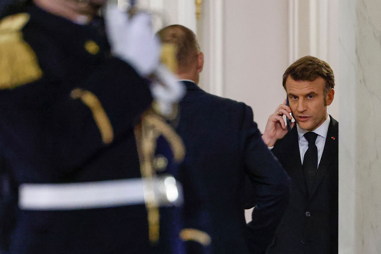France's President Emmanuel Macron speaks on the phone at the Elysee Presidential Palace in Paris on Mar. 5, 2025. (Ludovic Marin / AFP via Getty Images)
