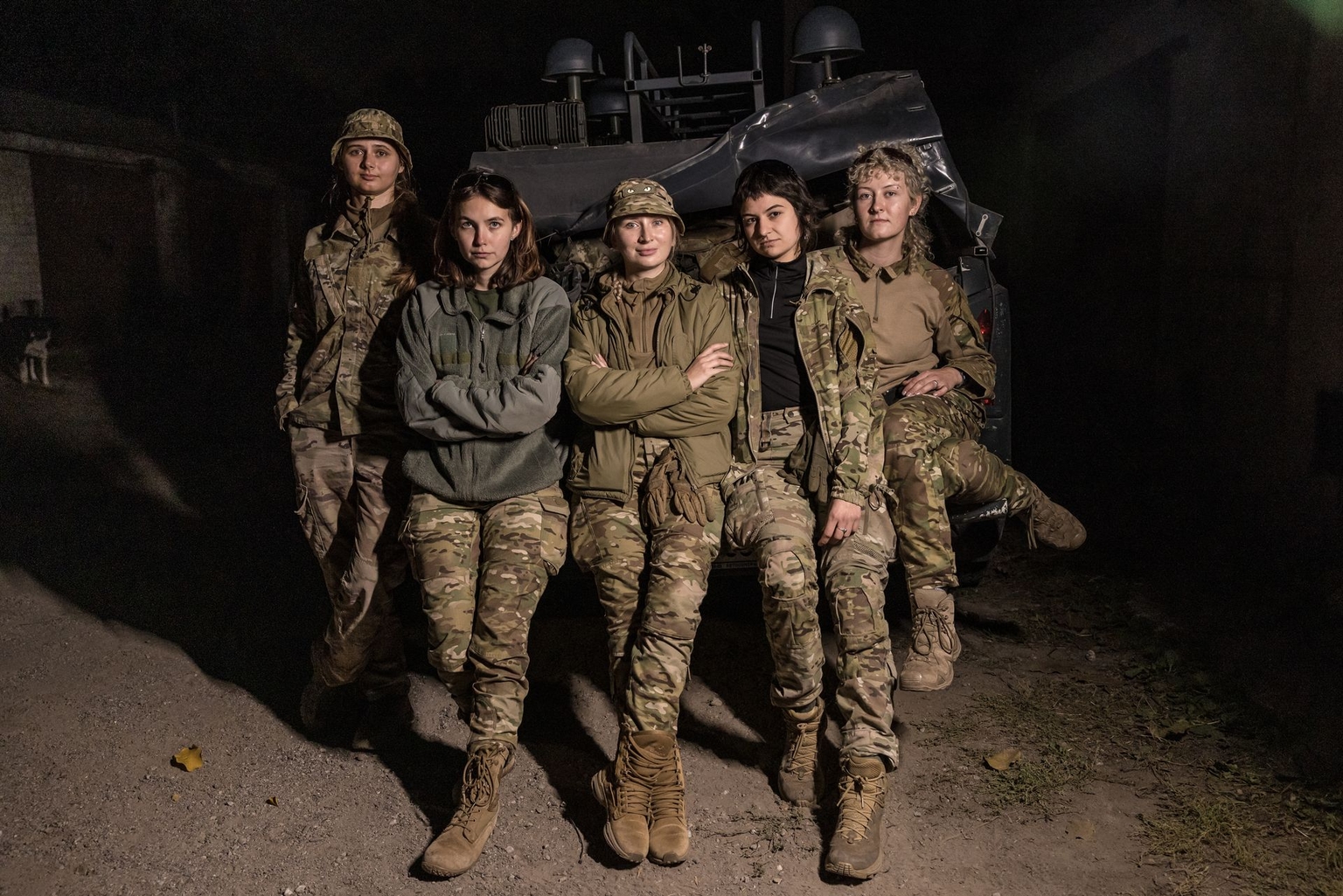Members of an all-women UAV crew with the Typhoon special forces unit of the National Guard of Ukraine pose for a portrait after completing a military mission.