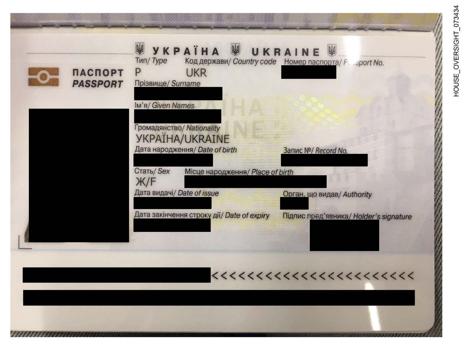 An image of a Ukrainian woman's passport, with sensitive details redacted, released on Dec. 18 by Democratic members of the United States Congress as part of a larger set of photographs obtained from the Jeffrey Epstein estate. (House Oversight Committee)