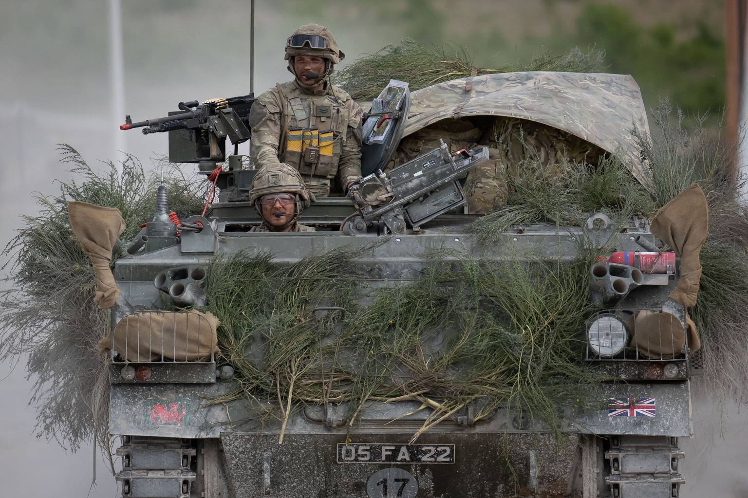 Soldiers from the Royal Welsh travel in a Warrior armored vehicle during Operation Ghaulish at the CENZUB urban combat training center in Sissonne, France, on April 22, 2025.