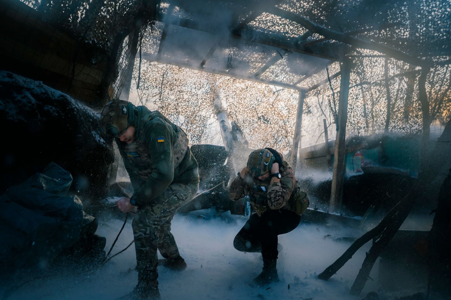 Artillerymen of the 152nd Separate Jaeger Brigade in combat positions as Artillery units of Ukraine's 152nd Separate Jaeger Brigade fire toward Russian positions on Jan. 1, 2026, in Pokrovsk District, Donetsk Oblast, Ukraine. (Marharyta Fal/Frontliner/Getty Images)