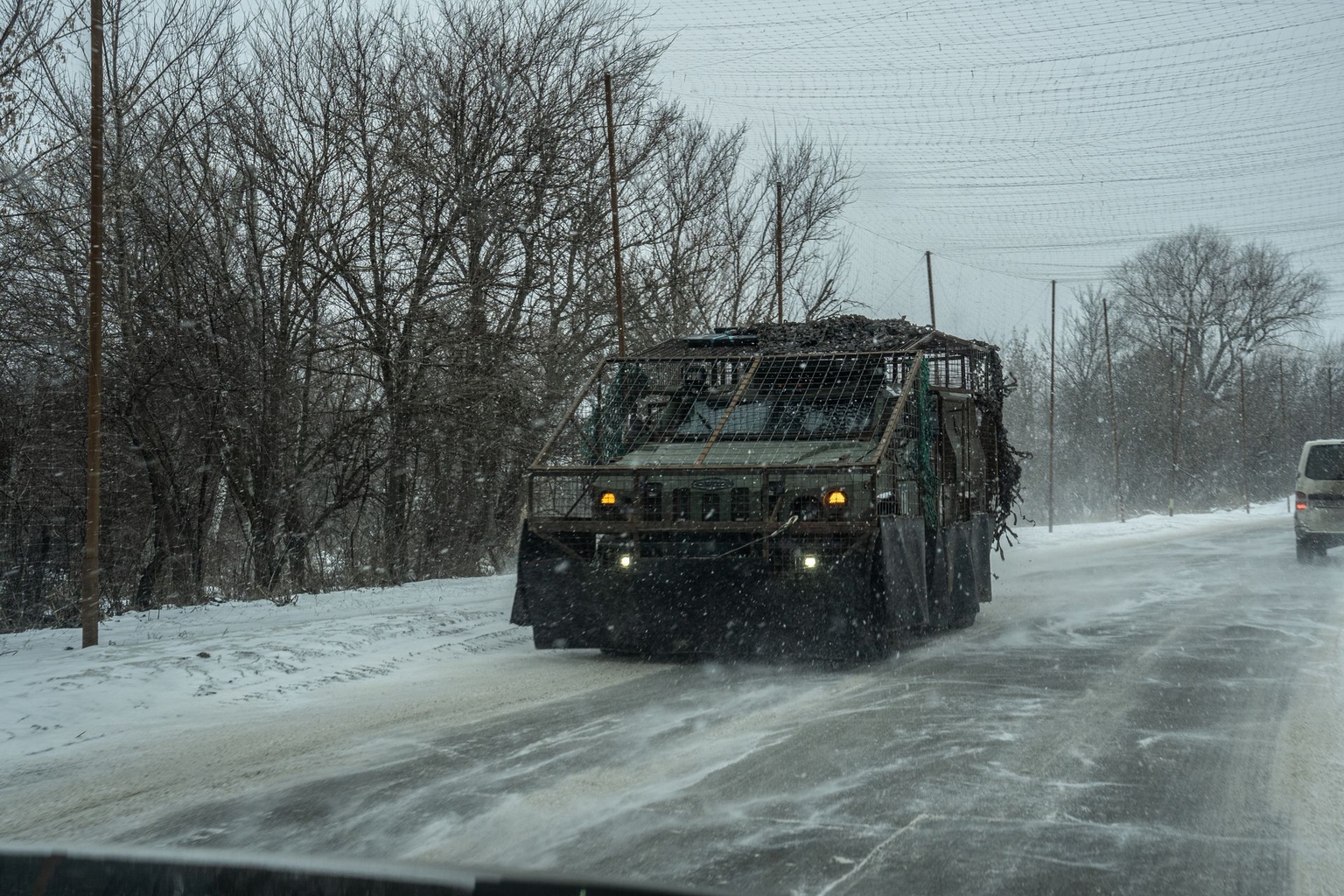 An armored vehicle drives along a road in Donetsk Oblast, Ukraine, on Jan. 24, 2026.