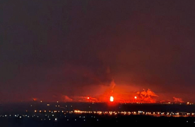 What purports to be a fire burning at Russia's Volgograd oil refinery following a drone attack that struck the site overnight on Feb. 11, 2026, (Exilenova+/Telegram)