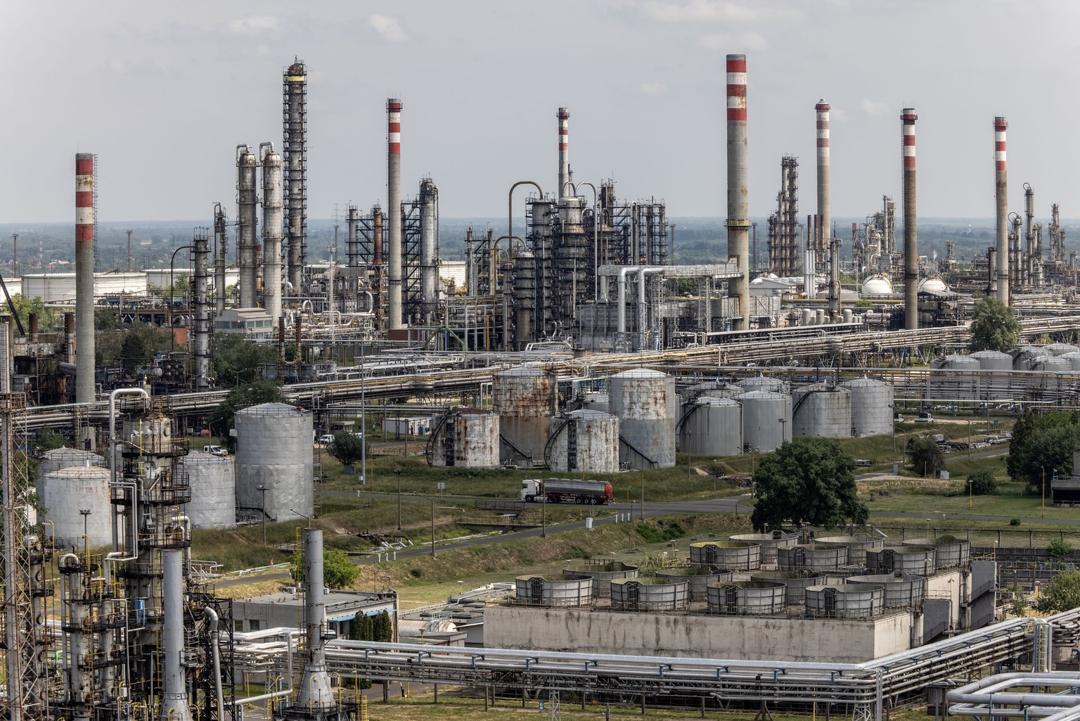 Oil transportation pipes, cracking towers and storage tanks stand at the Duna oil refinery in Szazhalombatta, Hungary, on May 24, 2022.