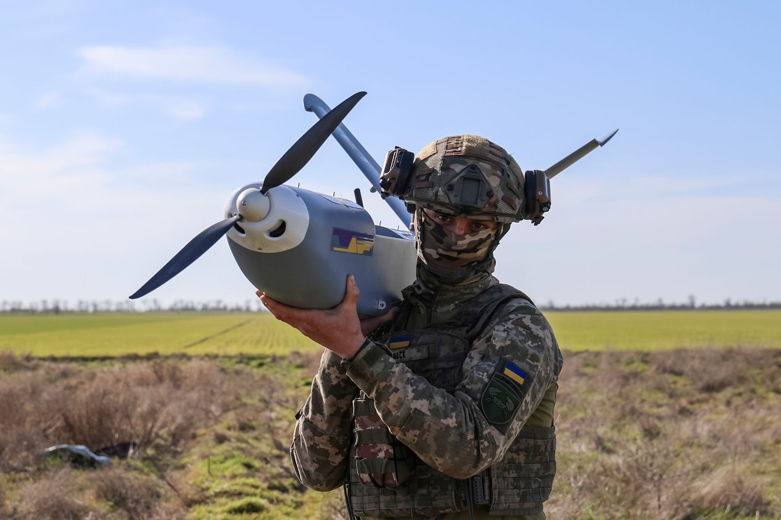 A serviceman with the call sign "Shok," from the 34th Coastal Defense Brigade, holds a GOR reconnaissance drone at a launch point in Kherson Oblast, Ukraine, on March 14, 2025. (Ivan Antypenko / Suspilne Ukraine / Global Images Ukraine / Getty Images)