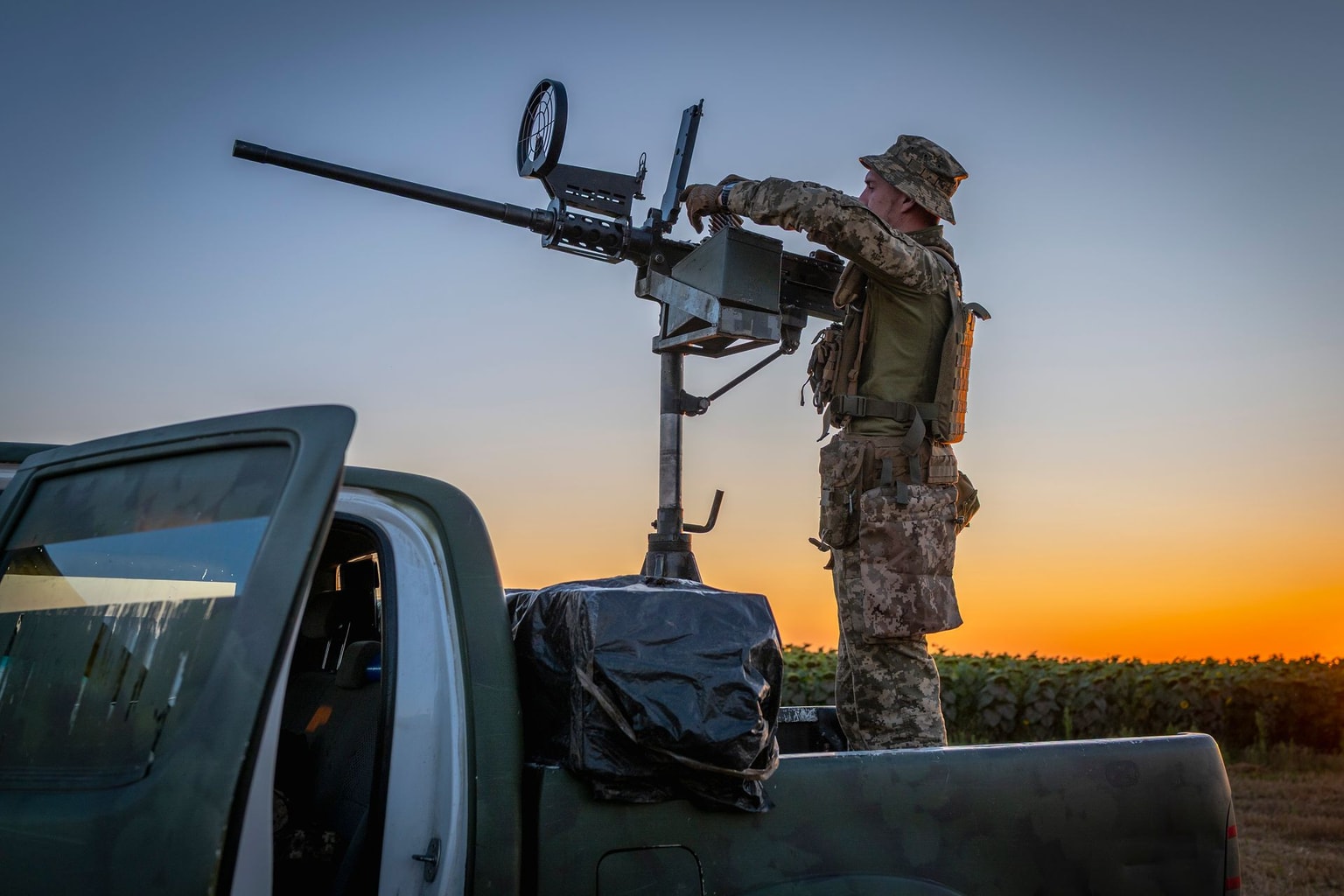 Ukrainian servicemen of a mobile anti-aircraft group work on a pickup truck with a machine gun on Aug. 13, 2025 in Chernihiv Oblast, Ukraine. (Dan Bashakov/Global Images Ukraine via Getty Images)