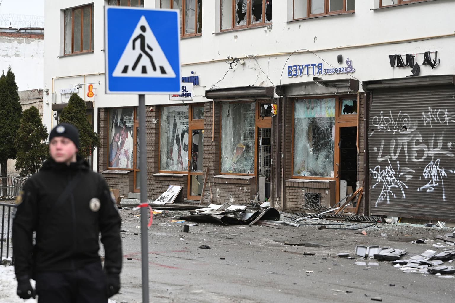 A Ukrainian police officer secures the area at the site of an explosion that struck Lviv, Ukraine, on Feb. 22, 2026