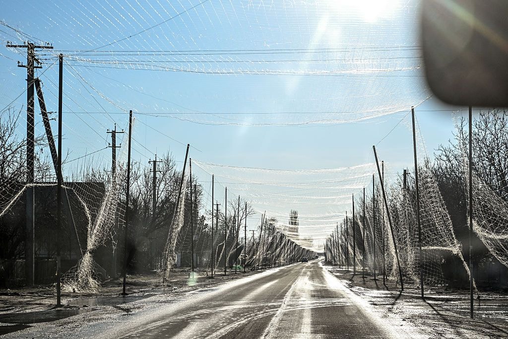 An anti-drone netting system covers a highway in Tavriiske, Zaporizhzhia region, Ukraine, on February 27, 2026. (Dmytro Smolienko/Ukrinform/NurPhoto/Getty Images) 