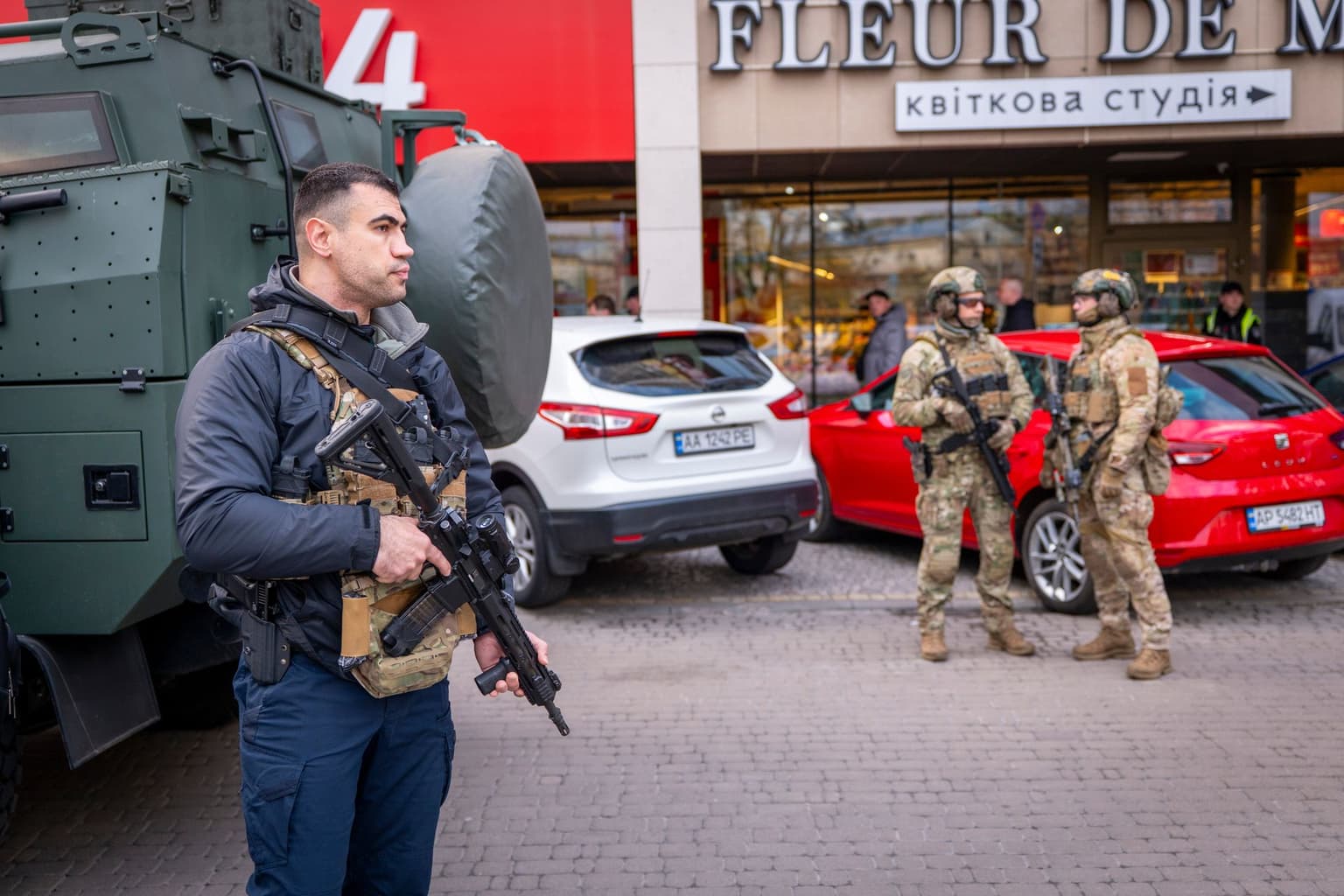 Police officers stand at the scene where a gunman killed at least six people in Kyiv, Ukraine, on April 18, 2026.