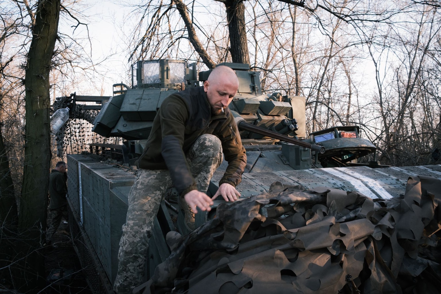A Ukrainian crew member of the 225th Assault Regiment on a Bradley infantry vehicle near the front line in Zaporizhzhia Oblast, on March 14, 2026. (Francis Farrell / The Kyiv Independent)
