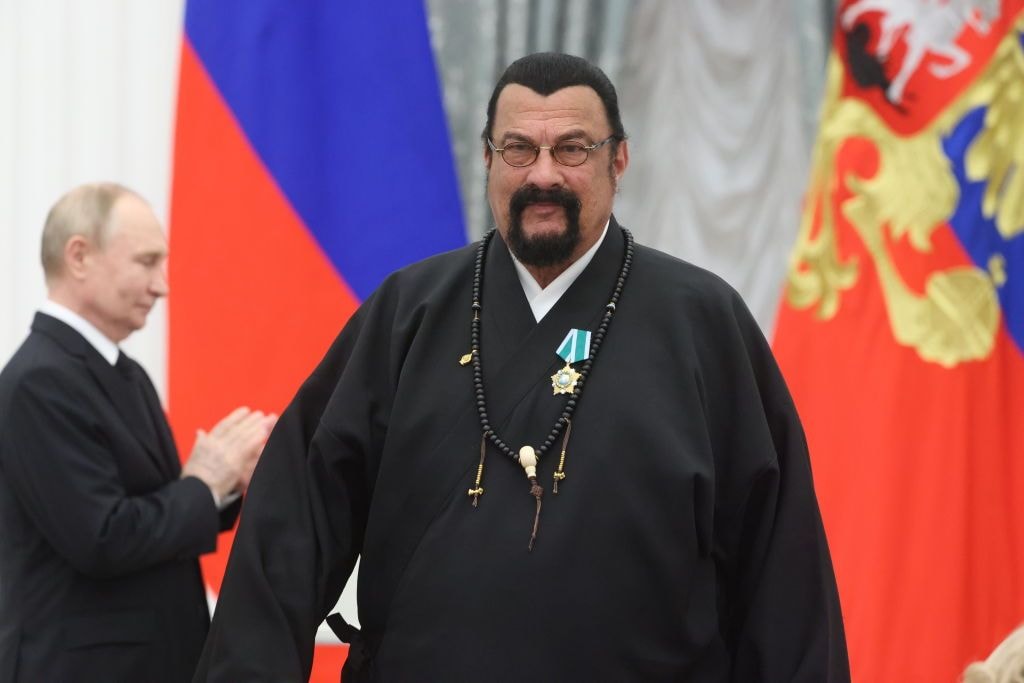 Russian President Vladimir Putin, left, stands with American actor Steven Seagal in Moscow on May 30, 2024. (Contributor / Getty Images)