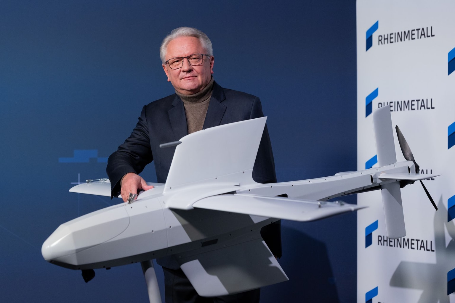 Armin Papperger, CEO of Rheinmetall AG, stands next to the new FV-014 drone at the annual press conference at Group headquarters. (Rolf Vennenbernd/picture alliance via Getty Images)
