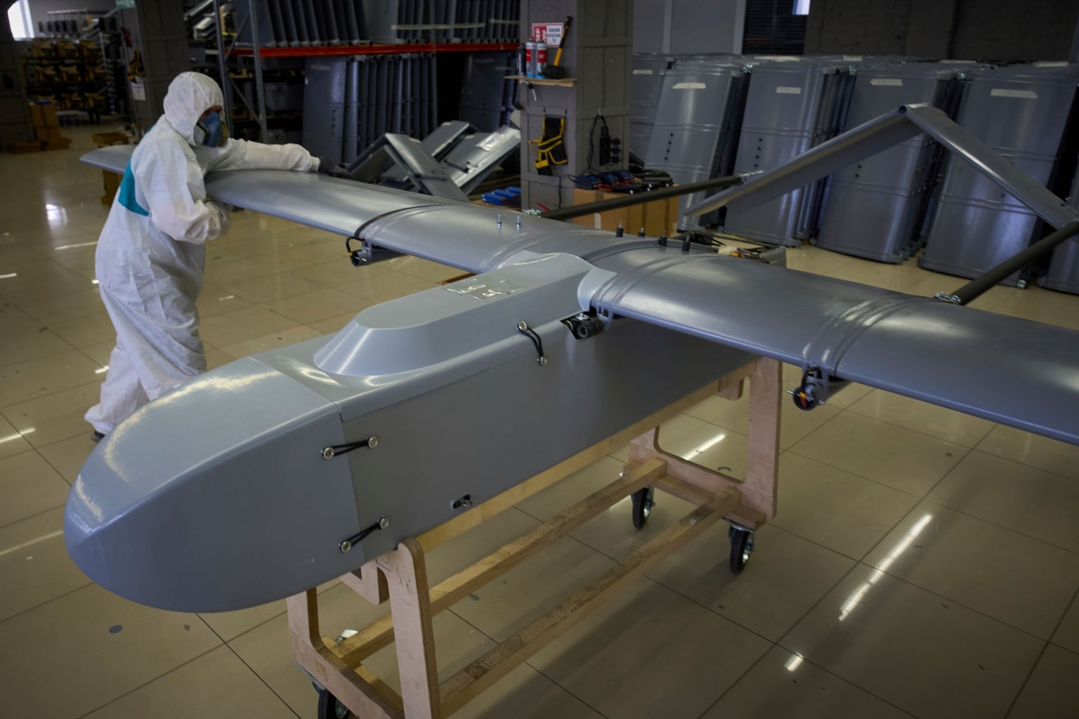 A worker inspects a combat drone at a Fire Point secret production facility in Ukraine on Aug. 18, 2025.