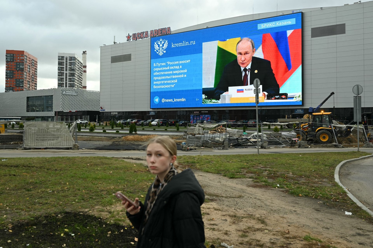A giant screen set on the facade of a sports and concert hall shows a picture of Russian President Vladimir Putin in Moscow, Russia on Oct. 24, 2024.