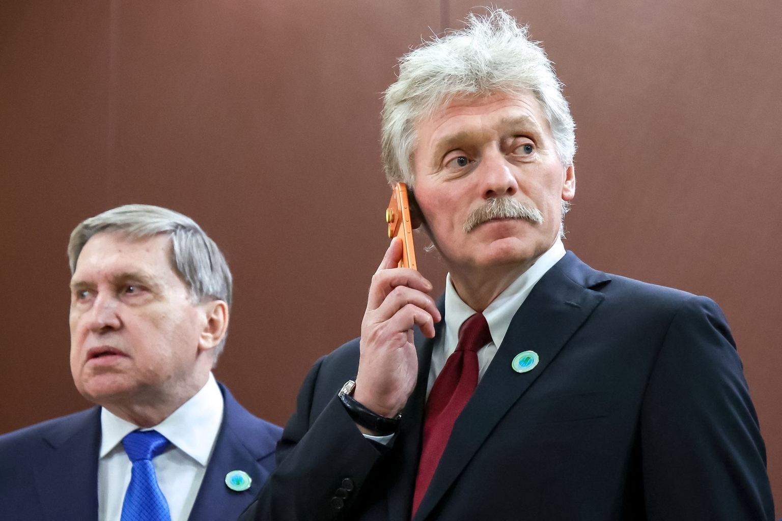 Kremlin spokesman Dmitry Peskov (R) and Kremlin aide Yuri Ushakov (L) in Ashgabat, Turkmenistan, on Dec. 12, 2025.