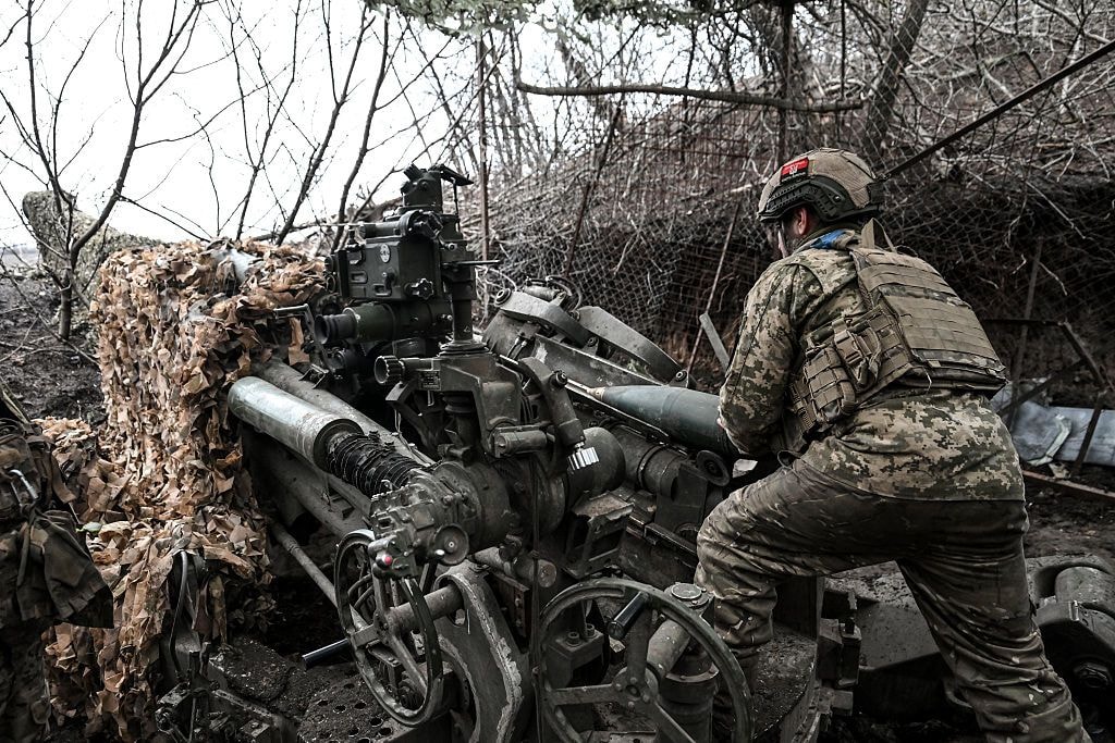 A soldier from the 44th Hetman Danylo Apostol Artillery Brigade of the Ukrainian Armed Forces loads a 155 mm shell into an M777 howitzer during a combat mission in Dnipropetrovsk region, Ukraine, on Dec. 24, 2025. (Photo by Dmytro Smolienko/Ukrinform/NurPhoto via Getty Images)