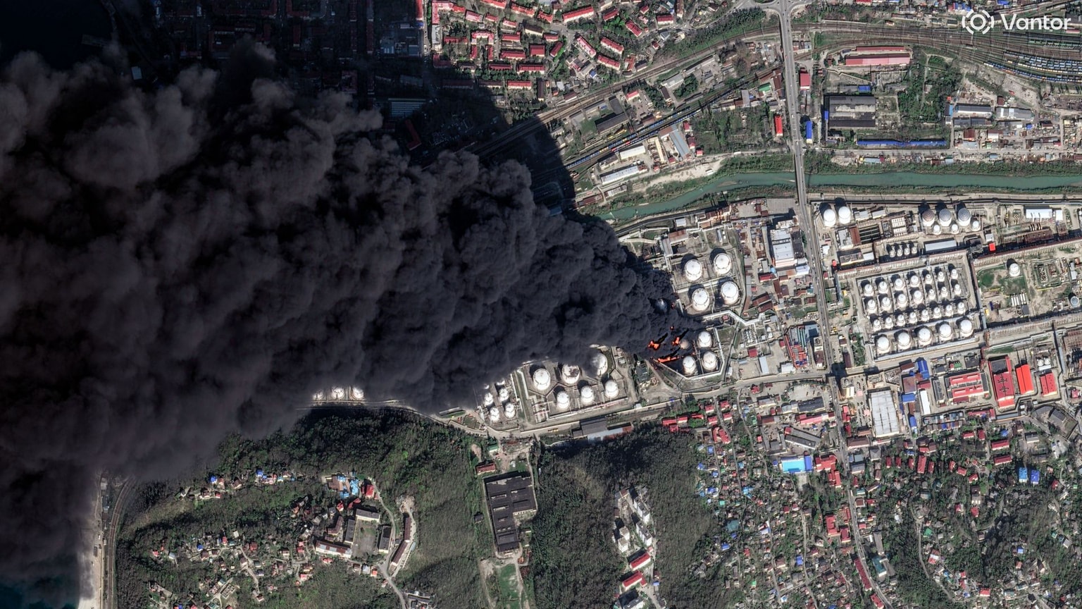 Vantor satellite image shows several oil storage tanks on fire with thick black smoke drifting south over the Black Sea at the Tuapse oil refinery on April 16, 2026. (Satellite image (c) 2026 Vantor)