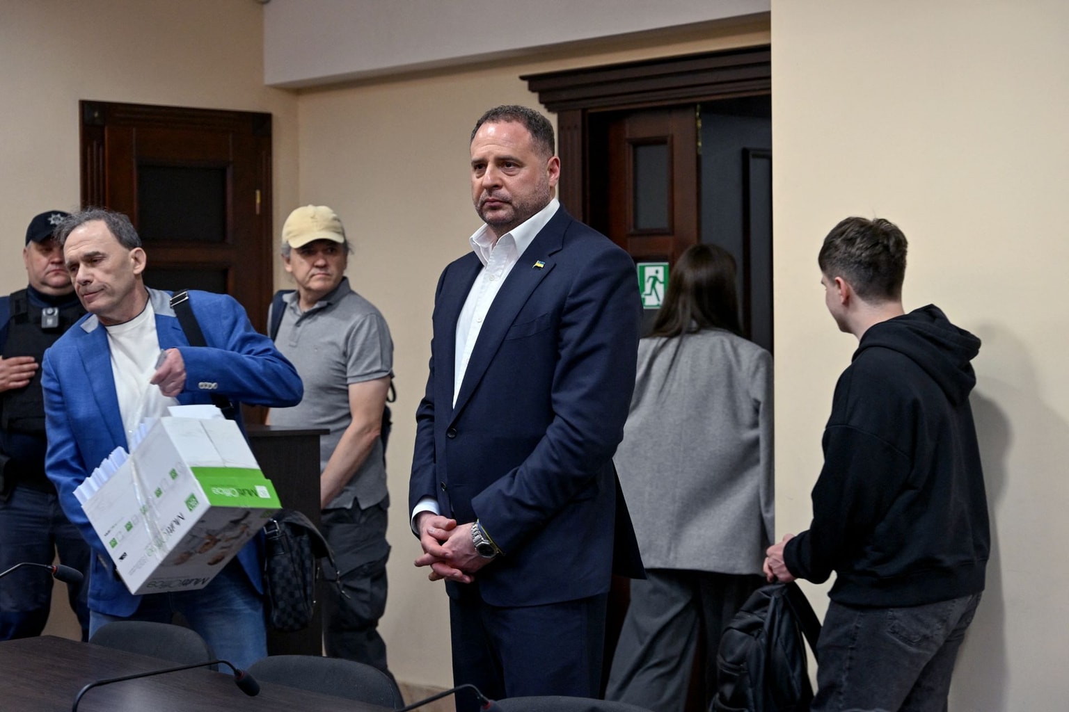 Andriy Yermak (C), stands in court before a hearing in a money laundering case, in Kyiv, Ukraine on May 12, 2026.
