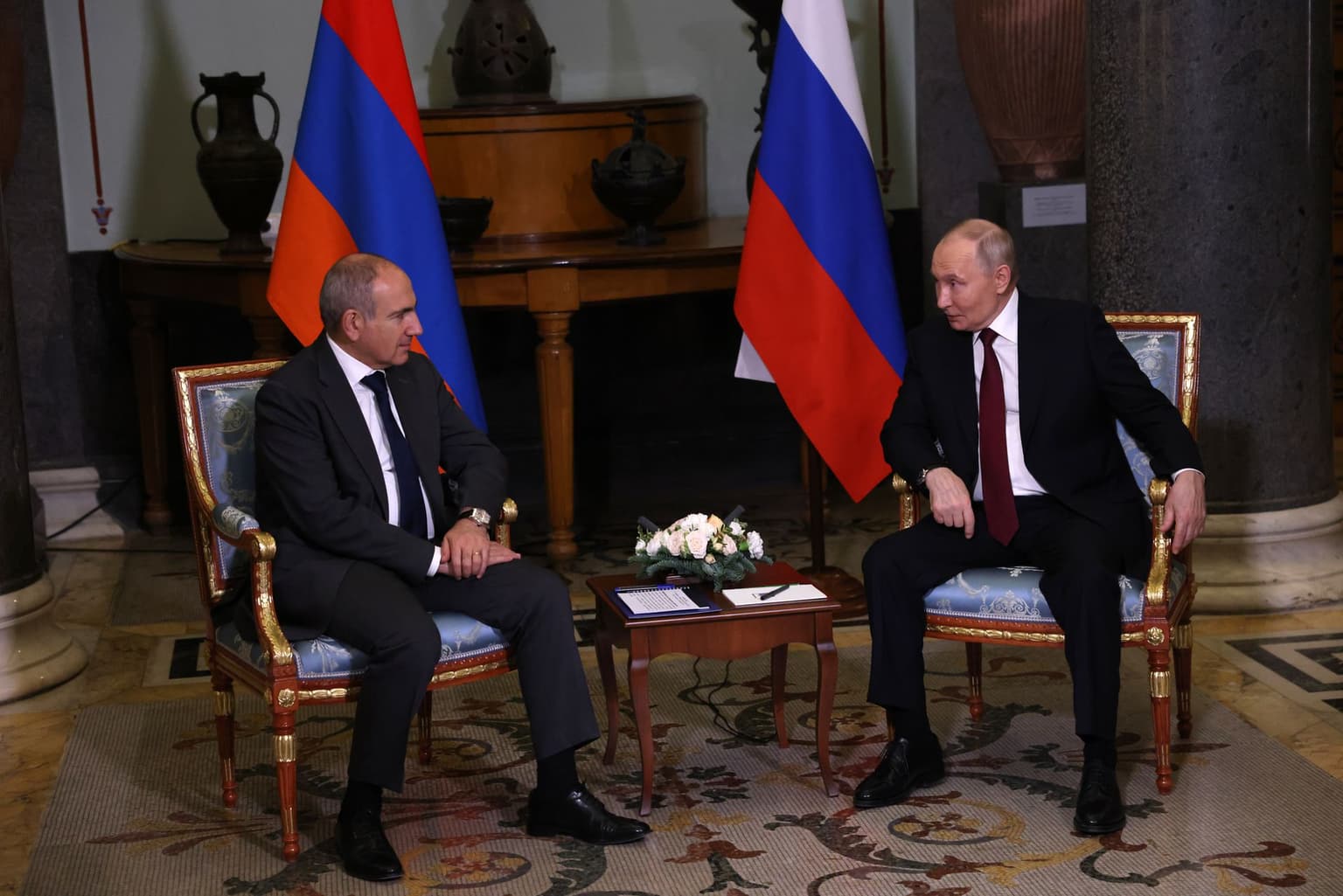 Putin (R) meets with Armenian Prime Minister Nikol Pashinyan (L) in Saint Petersburg, Russia, on Dec. 22, 2025.