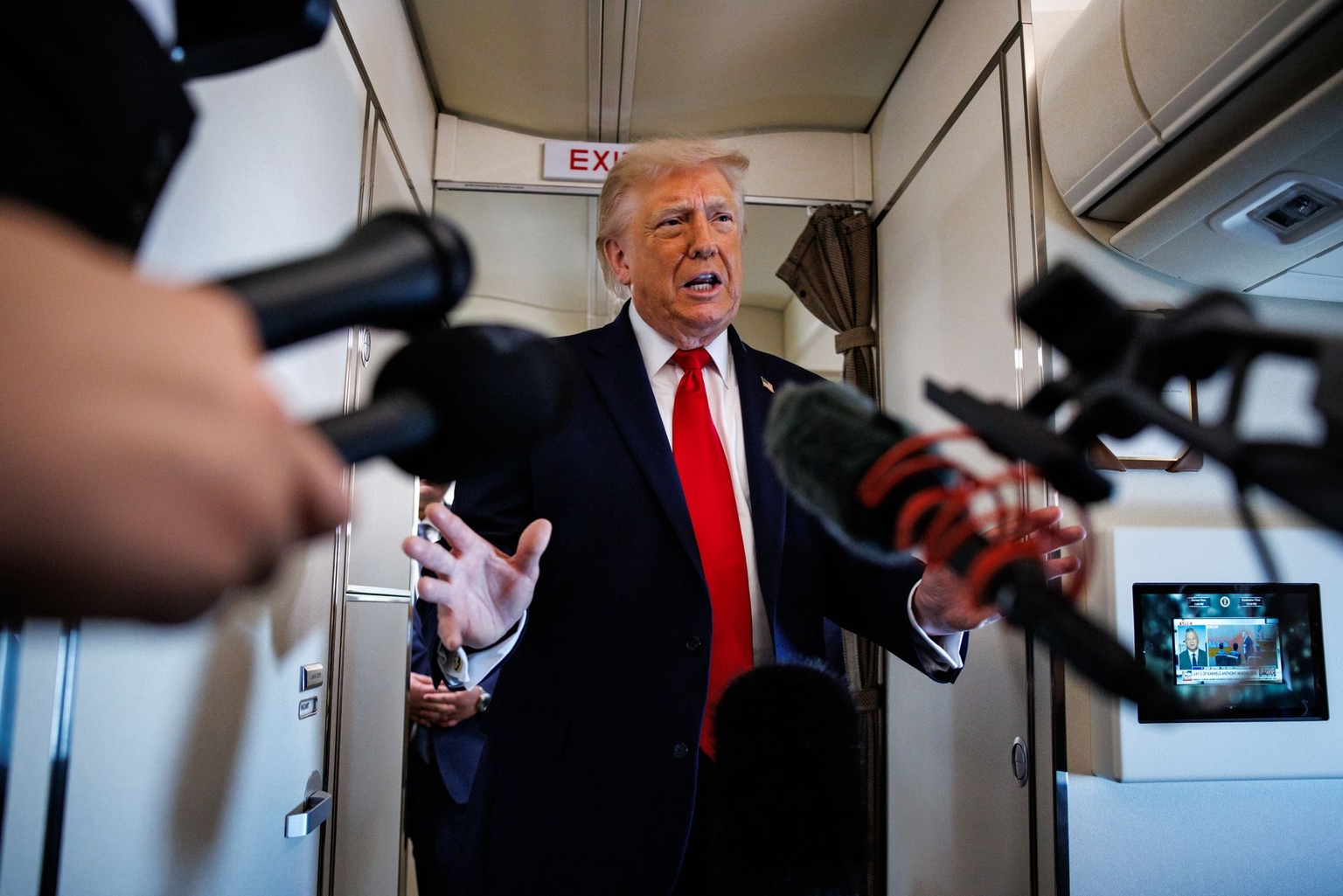 U.S. President Donald Trump speaks with reporters aboard Air Force One en route to Chippewa Falls, Wisconsin, on June 5, 2026.