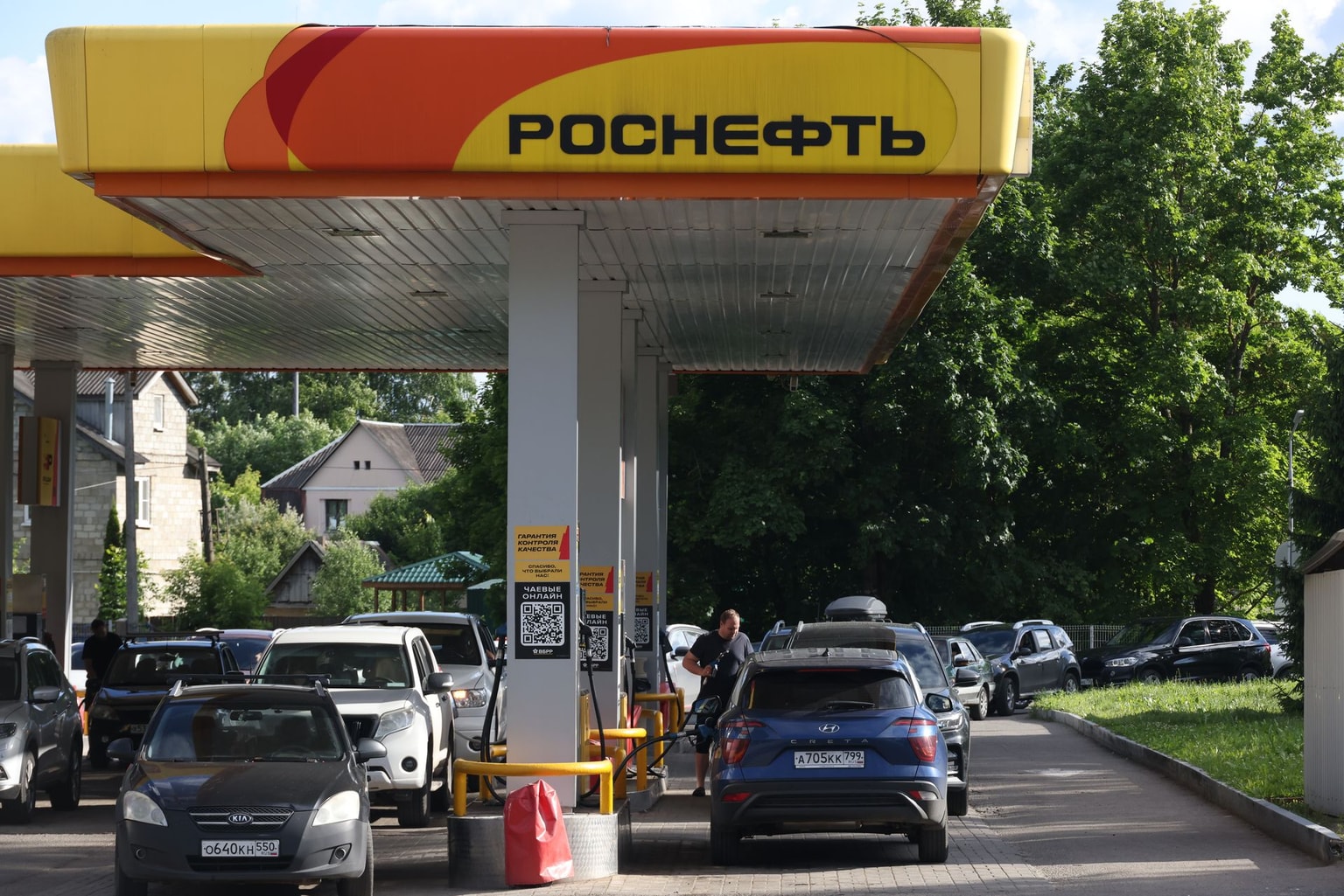 Photo for illustrative purposes. A man fills up his car with gas against the backdrop of a long line of cars at a Rosneft gas station, on June 20, 2026, in Dedovsk, Istra municipal district, outside of Moscow, Russia. (Contributor/Getty Images)