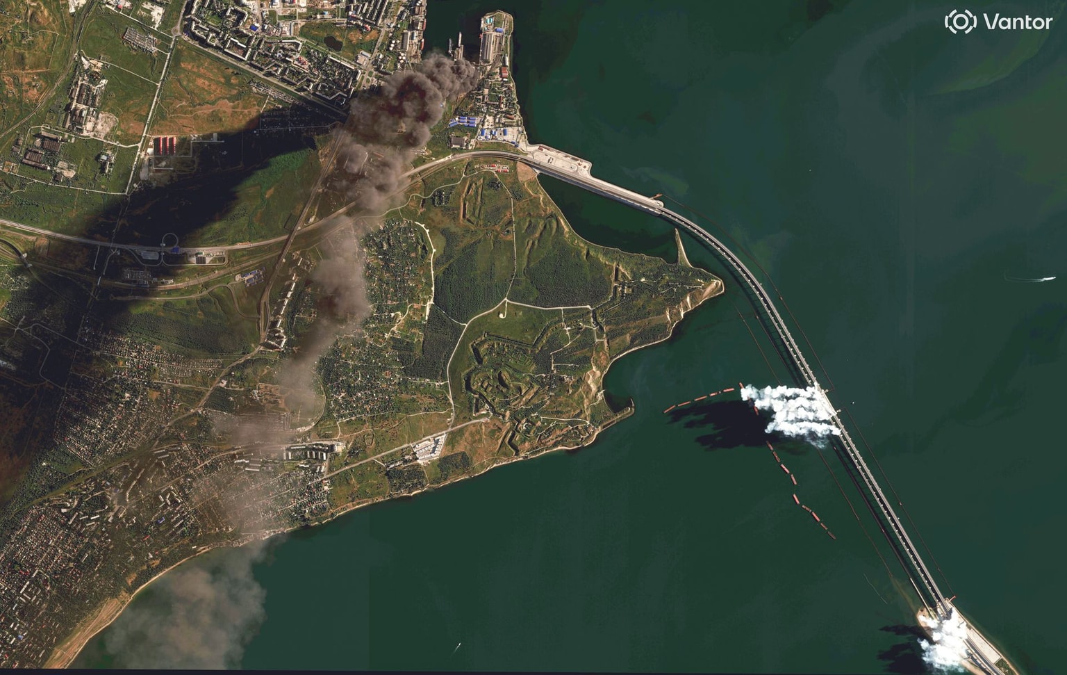 A Vantor satellite image taken June 22, 2026, shows burning oil storage tanks emitting dark smoke and smoke generator vehicles operating on the Crimea Bridge over the Kerch Strait. (Satellite image (c) 2026 Vantor via Getty Images.)